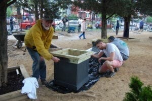 volunteers painting bench